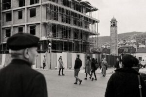 Town square in Kosovo with a half-built administration building under scaffolding and an Ottoman clock tower (AI-generated image)
